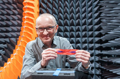 Prof. Piotr Jankowski-Mihułowicz presents a sample of a textronic RFID transponder,